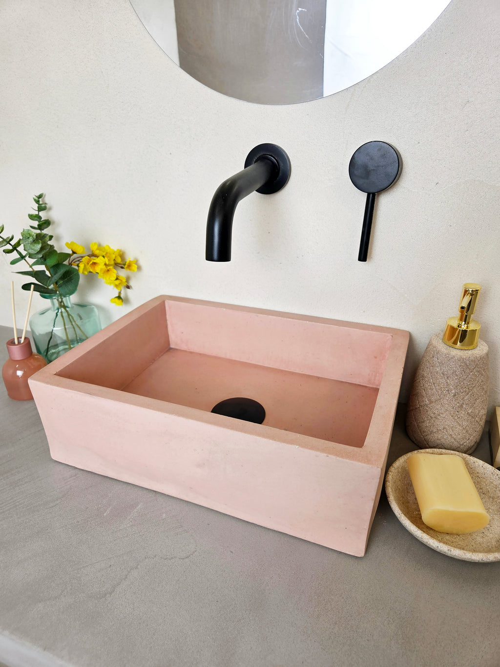 MINI concrete basin in pink, countertop mounted, angled view