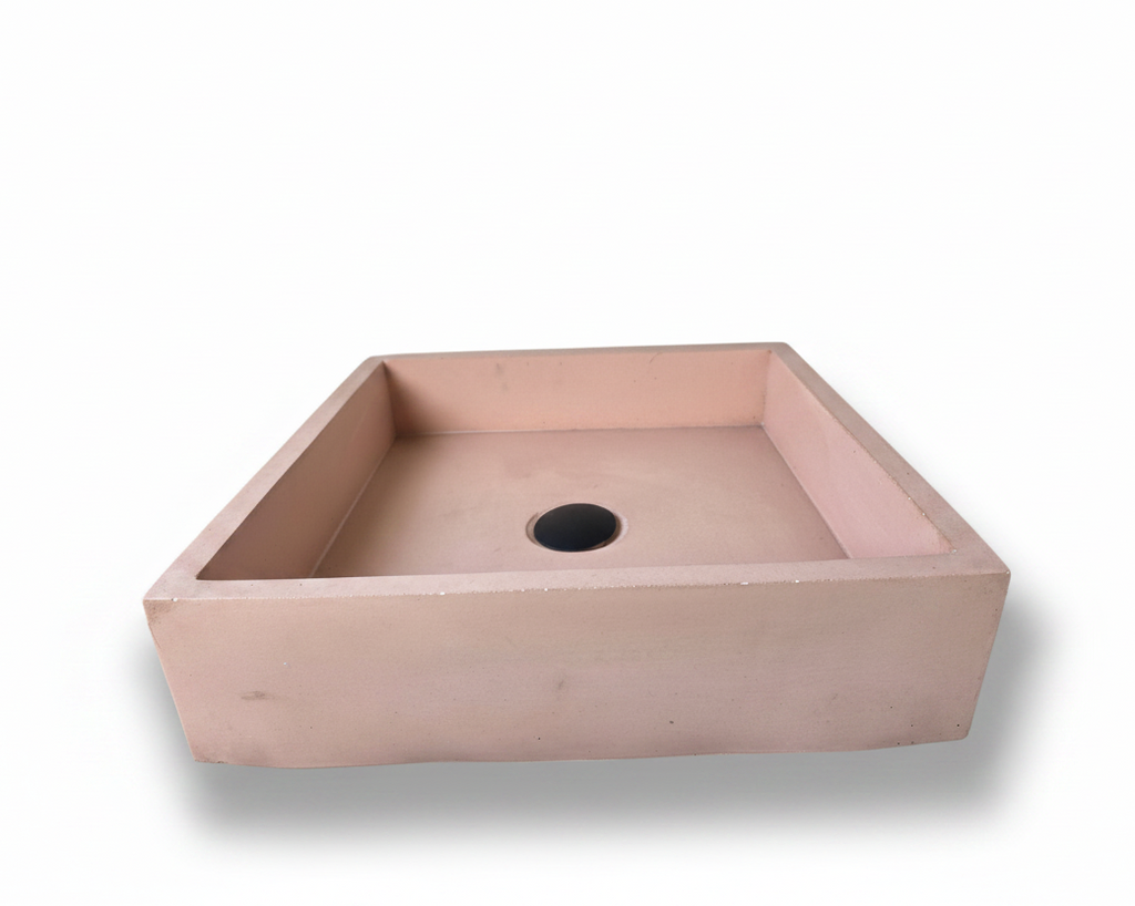 front view of pink rectangular concrete sink