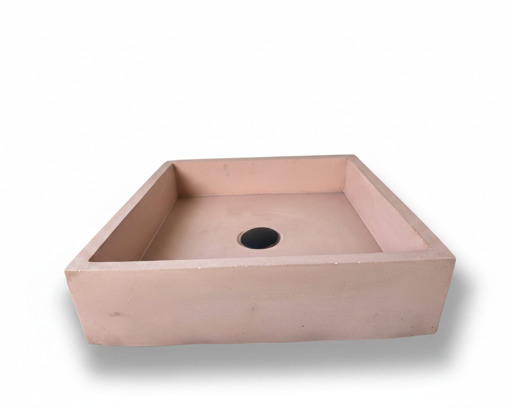 front view of pink rectangular concrete sink