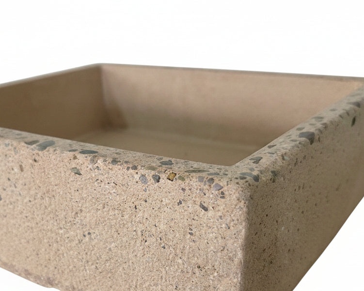 Beige concrete sink with exposed aggregate