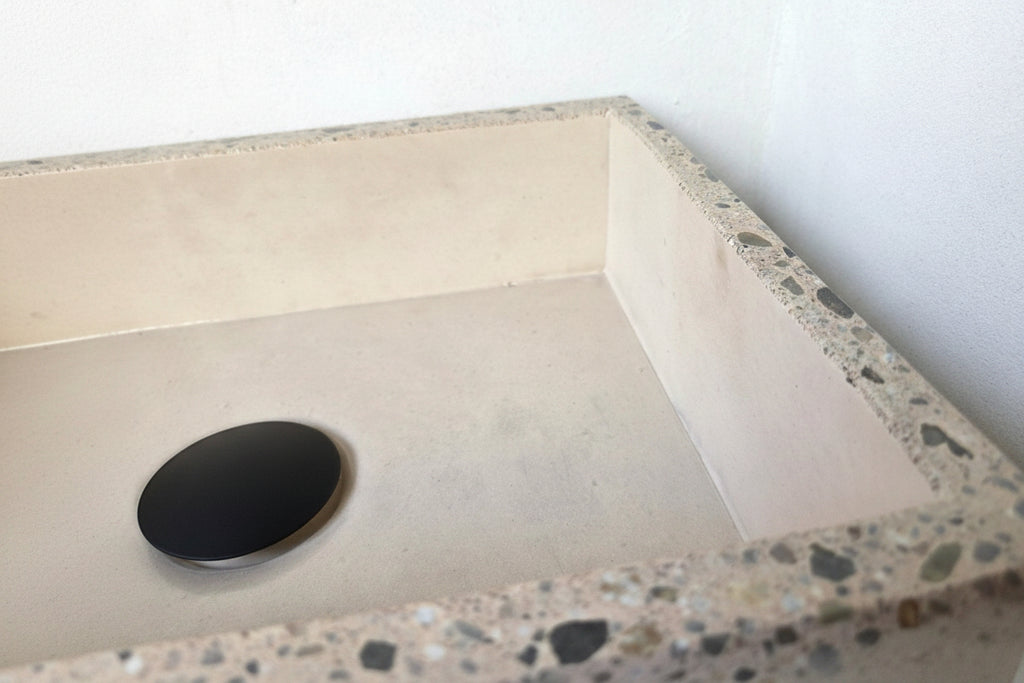 Close up of concrete sink polished edge with exposed aggregate