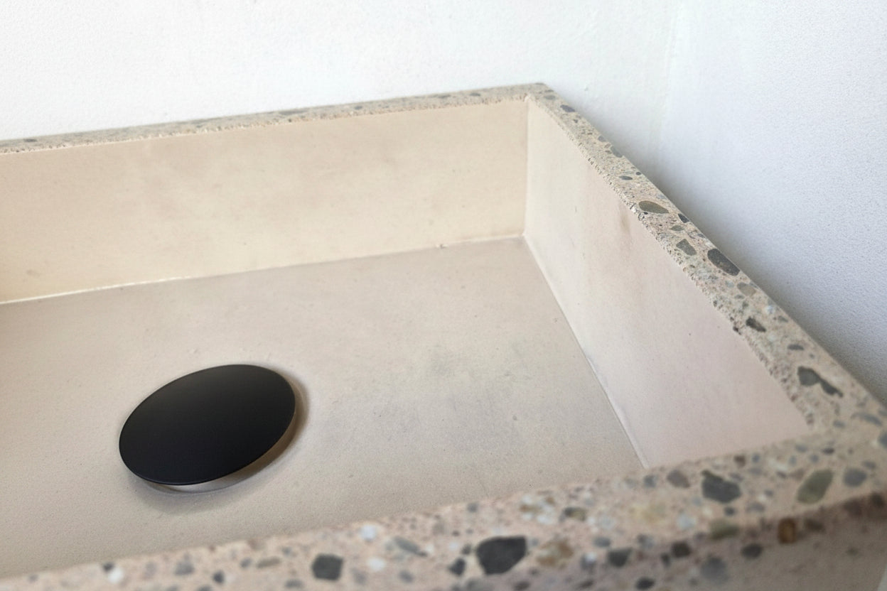 Close up of concrete sink polished edge with exposed aggregate