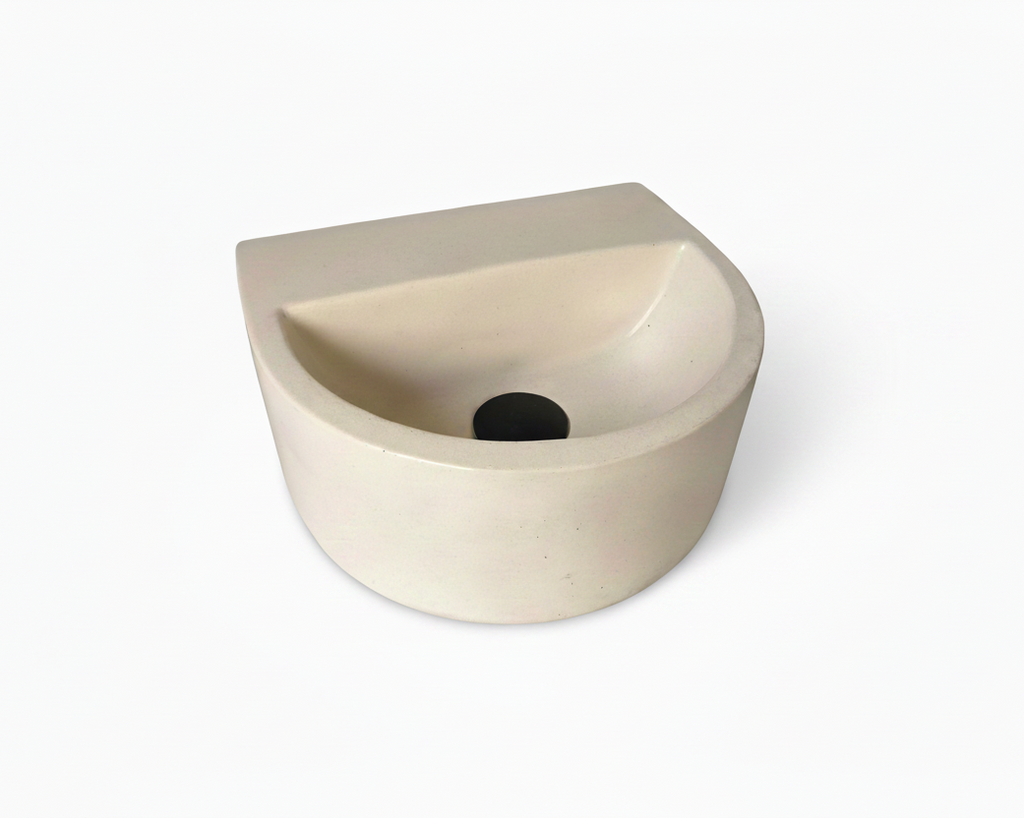a minimalis semi oval concrete sink in ivory colour