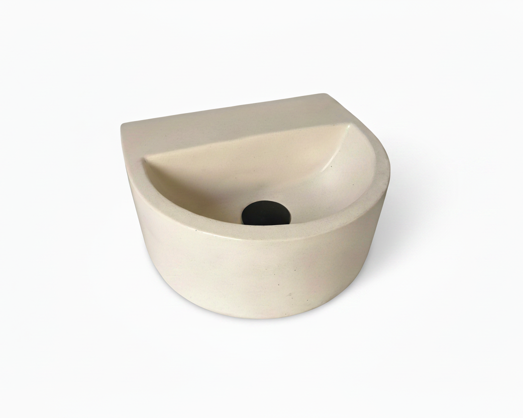 a minimalis semi oval concrete sink in ivory colour