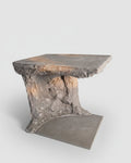 Concrete table with textured surface on a plain background