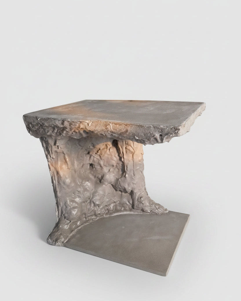Concrete table with textured surface on a plain background