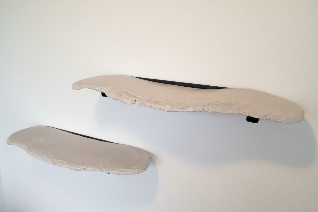 Side view of floating concrete wall shelf with minimalist mounting system