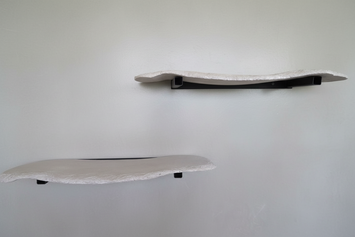Front view of floating concrete wall shelf with minimalist mounting system