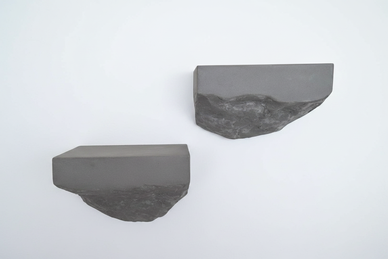 Two gray microcement shelves on a white background
