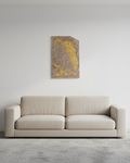 Beige sofa in a minimalistic living room with a abstract concrete wall art  on the wall.