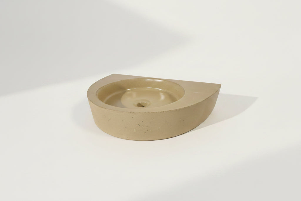Half round basin designed for wall installation