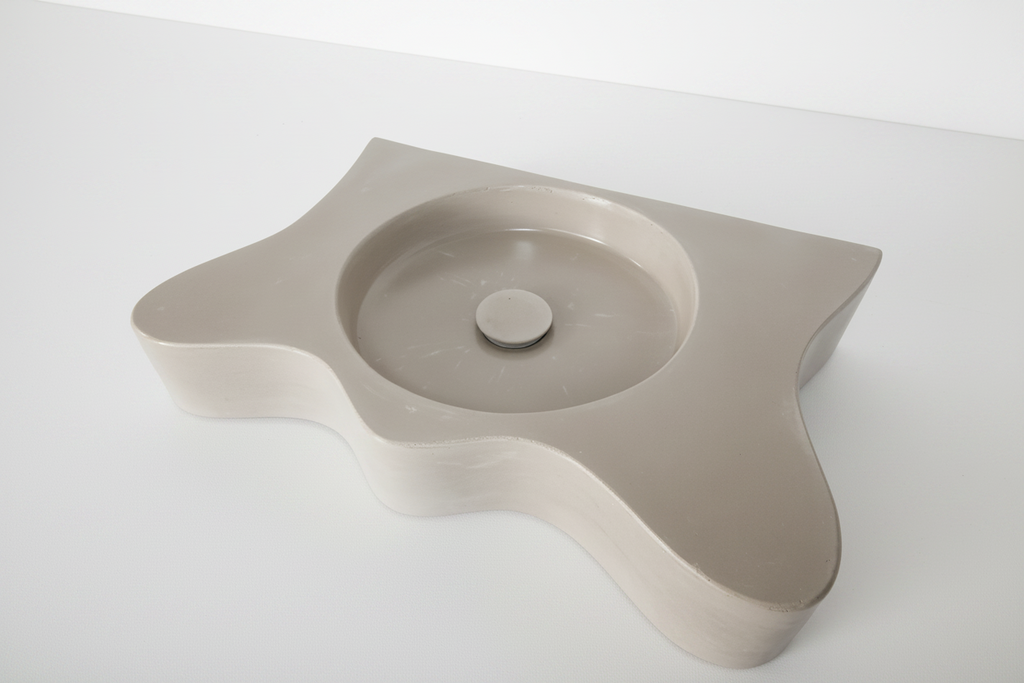 a concrete vanity with wavy shape on white background