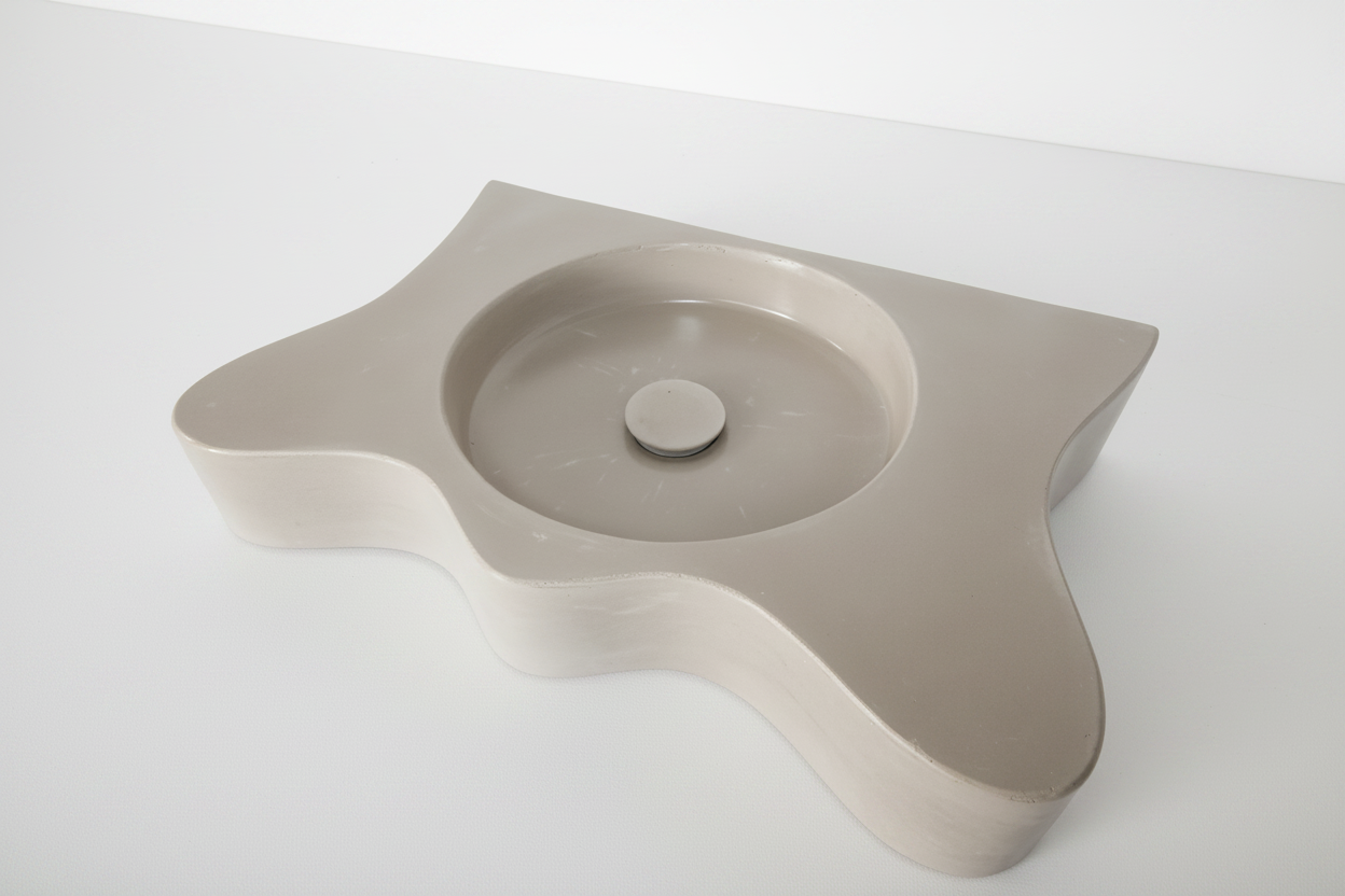 a concrete vanity with wavy shape on white background