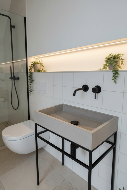 close up of grey concrete sink  with black accessories in modern minimalistic bathroom