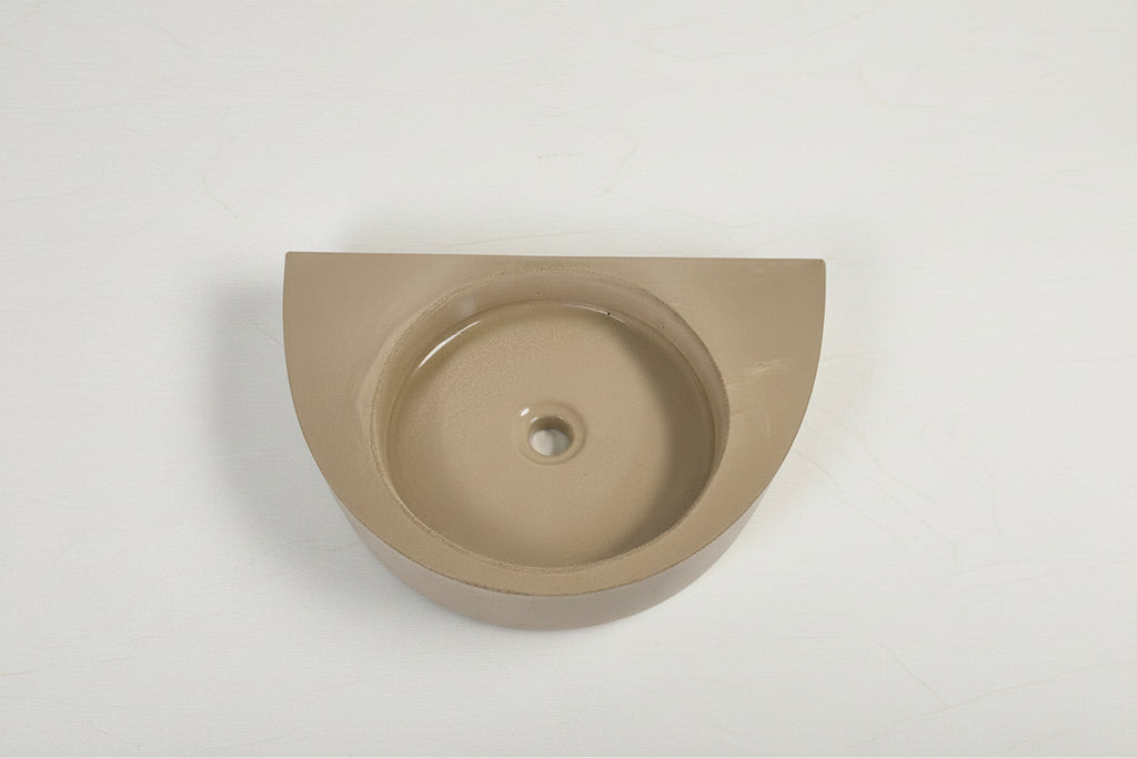Minimal concrete basin designed for small spaces